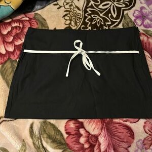 Black mini skirt with white bow